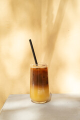 Glass with iced Pineapple Bumble. Fresh summer cocktail with coffee