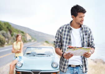 Road trip, lost and man thinking with map outdoor for travel, vacation or holiday by car with...