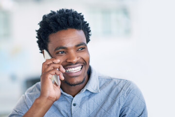 Happy, black man and agent with phone call for friendly discussion, chat or proposal at office. Young African, male person or consultant talking on mobile smartphone for online advice or conversation