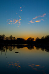 Tranquil sunset over Danube island Sodros reflecting calm waters near Novi Sad, Serbia