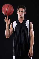 Fitness, basketball and portrait of man athlete in studio with practicing, workout or training for game. Activity, career and male person with sport equipment for match exercise by black background.