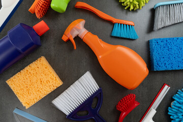 House cleaning plastic product on black table background, home service or housekeeping concept