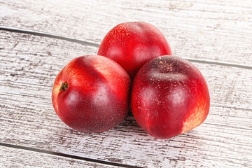 Ripe sweet juicy nectarines heap