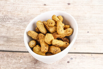 Raw ripe unpeeled peanut heap