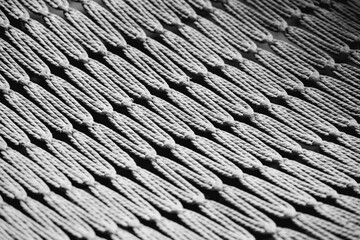 A detailed view of a knitted textile featuring a geometric design