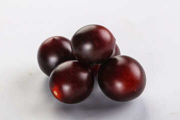 Raw ripe black kumato tomato