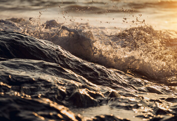A large rocks surrounded by waves of the ocean