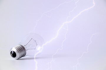 Incandescent lamp and lightning on isolated background, light and electricity, voltage