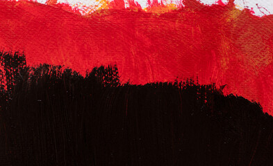 黒色と赤色の絵具で塗った背景
