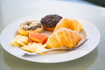Breakfast plate with pastries and fruits