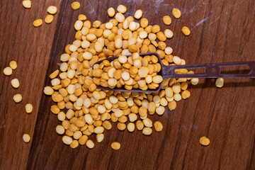 Organic bengal gram (cicer arietinum) in spoon on wooden background