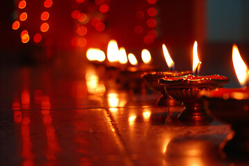 illustation of Diwali festival of lights tradition Diya oil lamps against dark background
A traditional Indian art of decorating the entrance to a house. Diwali festival holiday design. 
