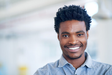 Business, creative and portrait of black man in office with smile, confidence and mockup at agency. About us, design and happy businessman with opportunity, trust and professional pride at startup