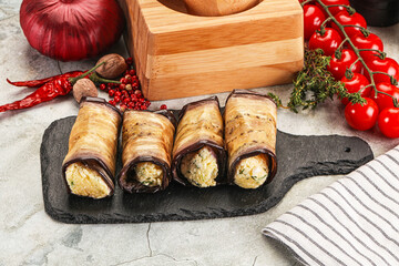 Baked eggplant roll with cheese