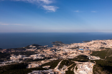 Industry marble quarry and cut white blocks, aerial top view Turkey destruction environment.
