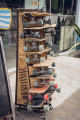 A stack of skateboards on a special outdoor stand