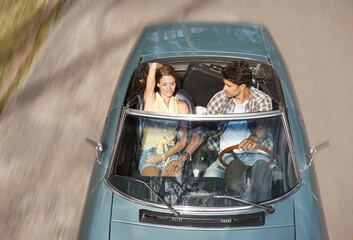 Couple, travel and driving sports car on road trip, holiday or above highway on vacation adventure....