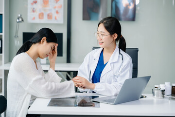 Doctor discussing treatment with Female patient talks to discuss results or symptoms and sitting on...