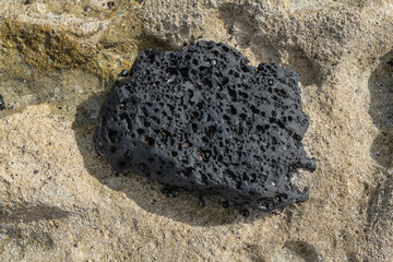 Basalt. Beachrock is a friable to well-cemented sedimentary rock that consists of a variable...