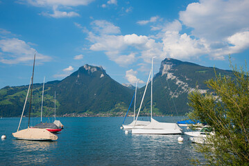 moored sailboats at Faulensee harbor, lake Thunersee switzerland