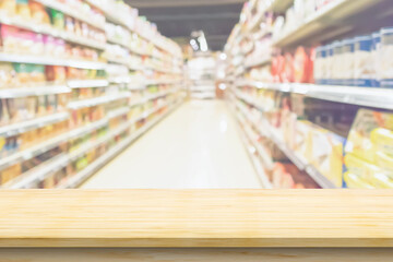 Empty wood table top with supermarket blurred background for product display