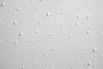 Water drops on white wall background texture