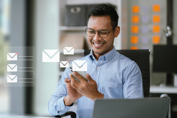 Email notification concept, Male use smartphone and laptop receive message alert in the mailbox.