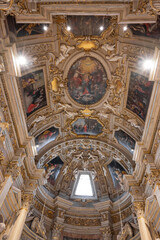 A cathedral illuminated with lights and adorned with paintings in the province of Pesaro and Urbino
