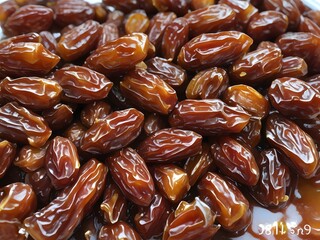 dates close up. date palm background. Date palm on a traditional craftsman market.Horizontal image.