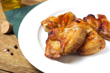 Fried chicken wings in a plate on the table