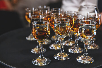 Crystal glasses filled with amber-colored liquor