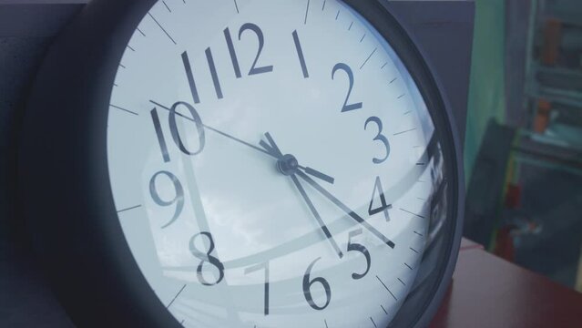 Closeup timelapse of a clock changing the time fast from 2:05 pm to 7:30 pm
