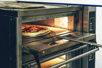 Fresh pizza baked in oven