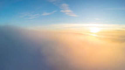 Sunset over the clouds