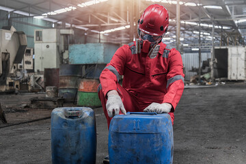Portrait worker in protective helmet and mask. Workers wear protection suit checking chemical in...