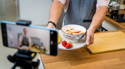 The chef is broadcasting live from workshop how to prepare a vegetarian food
