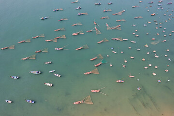 Birds eye view of traditional Vietnamese fishing boats in Da Nang bay on sunny day. Vietnam.