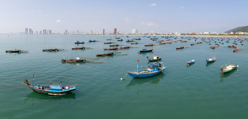 Panoramic aerial view of traditional Vietnamese fishing boats in Da Nang bay on sunny day. Vietnam.