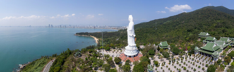 Panoramic aerial view of Chua Linh Ung temple and Lady Buddha statue on sunny day. Da Nang, Vietnam.