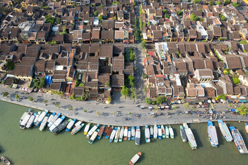 Drone view of historical part of Hoi An town and Thu Bon river on sunny day. Vietnam.