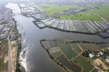 Drone view of farmlands in Thu Bon river delta on sunny day. Surroundings of Hoi An, Vietnam.