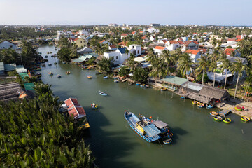 Naklejka premium Aerial view of Coconut basket boats village (touristic attraction) o sunny day. Hoi An, Vietnam.