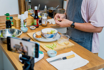 The chef is broadcasting live from workshop how to prepare a vegetarian food