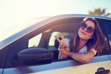 Woman, peace and sunglasses by car window in summer for freedom, travel and vacation with sunshine...