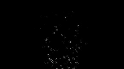 Floating of air bubbles on black background