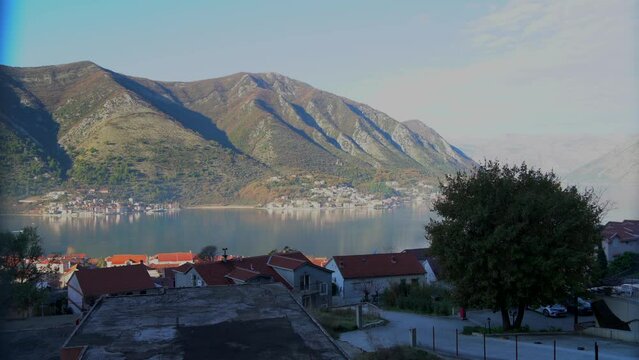 View of the small town of Prcanj as seen from Dobrota town on the Bay of Kotor, Montenegro