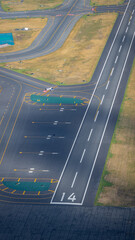 Aerial shot of Boston's Logan International Airport runways with planes taxiing.