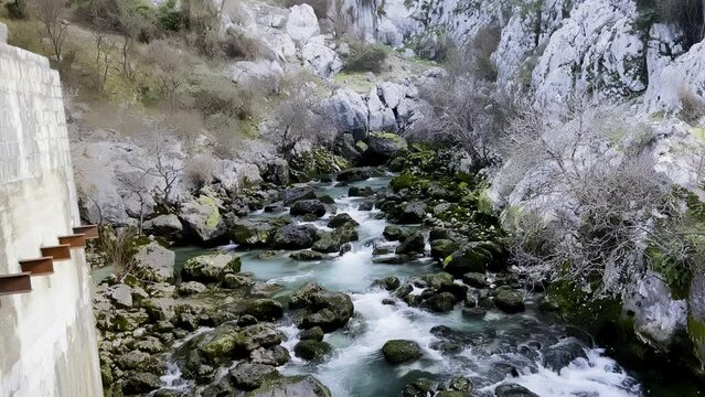 Ljuta River flowing on rocks between mountains near Donji Orahovac village in Kotor, Montenegro