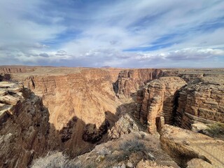 Antelope Canyon with rocks and sparse vegetation in Arizona