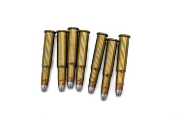 handful of old 30-30 caliber bullets for Winchester lever-action rifle on white background